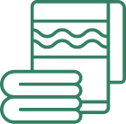 A green line icon of a towel and a book, representing alternative medicine and fertility treatments. atma acupuncture