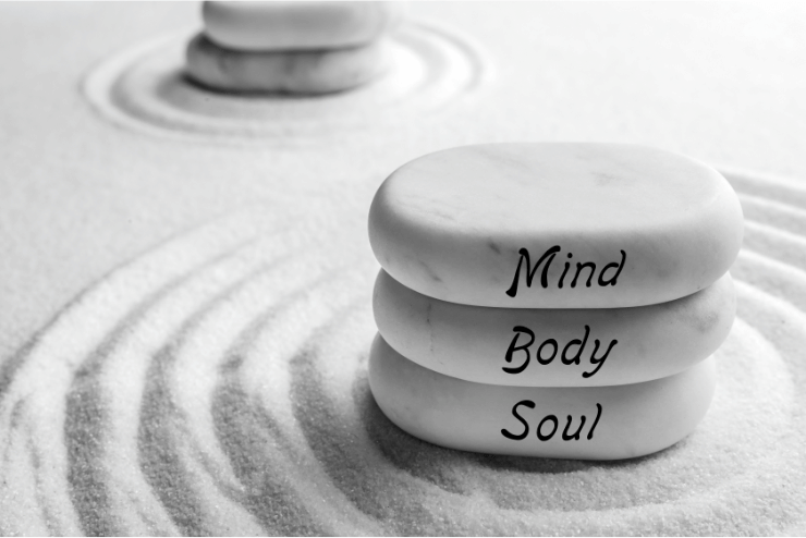 Three stones with the words mind body soul stacked on top of each other, representing the holistic therapy and alternative medicine practices in Fort Lauderdale, Florida. atma acupuncture